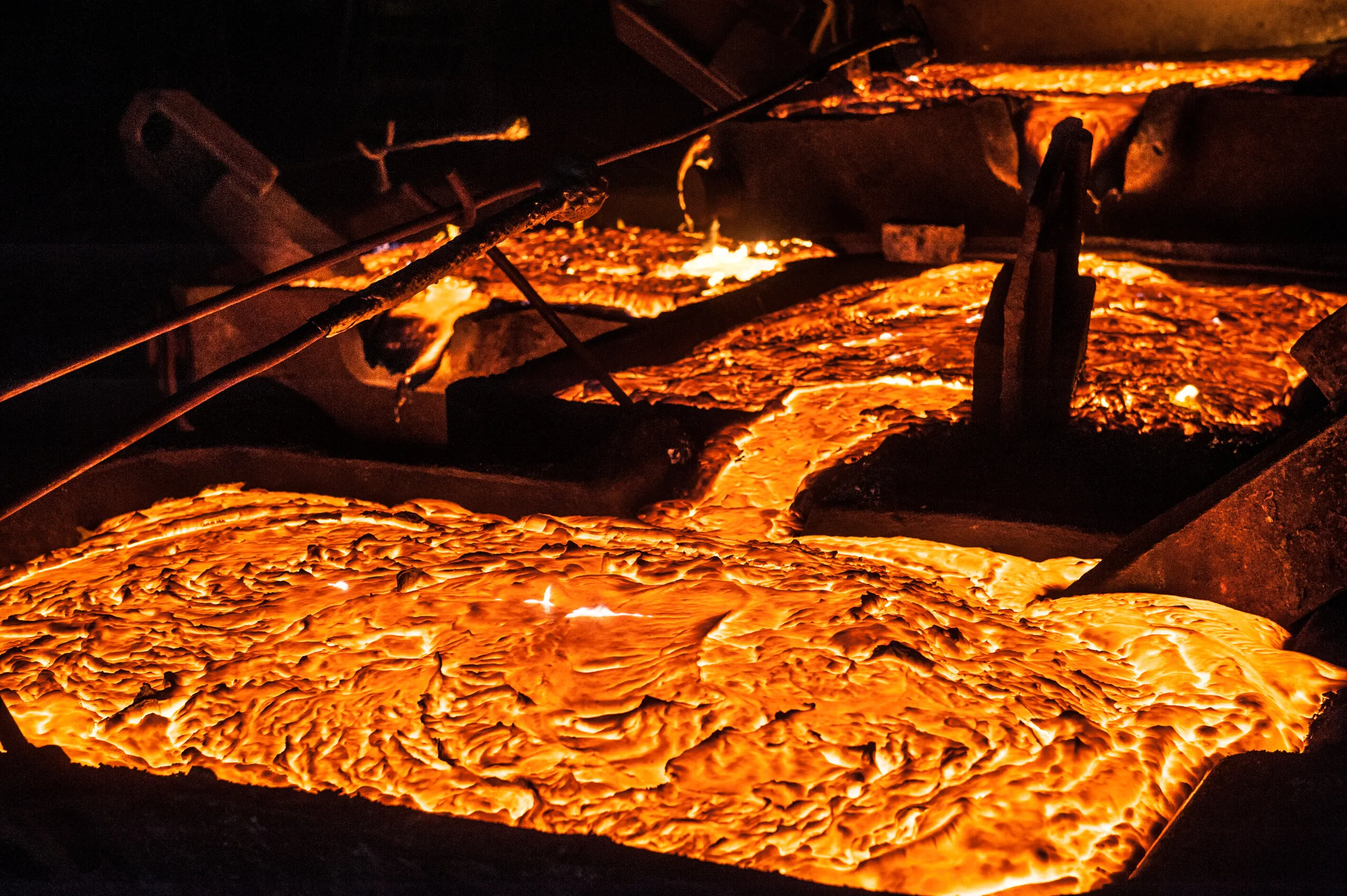 Molten metal flowing through a casting channel