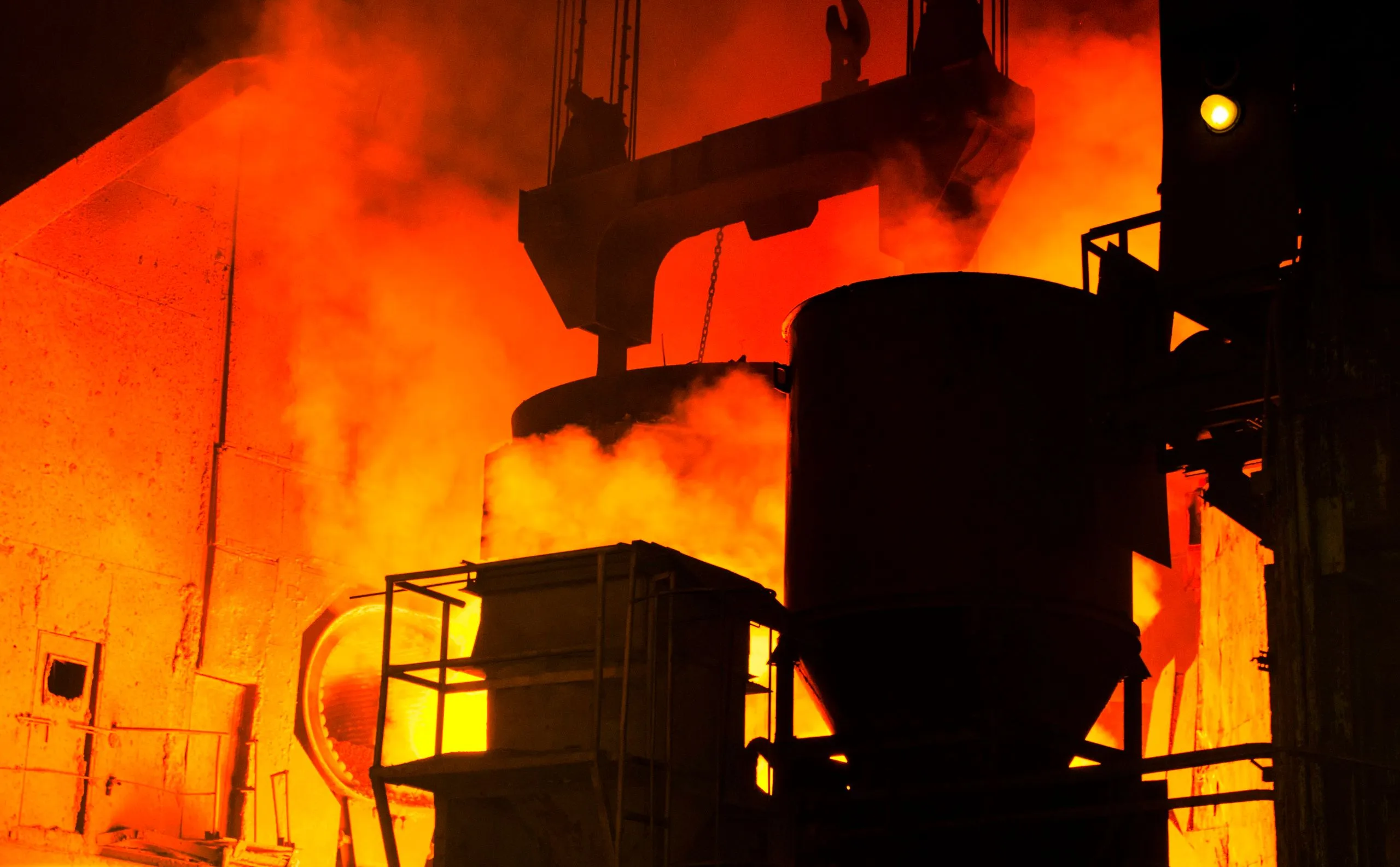 Furnaces glowing inside a steel mill