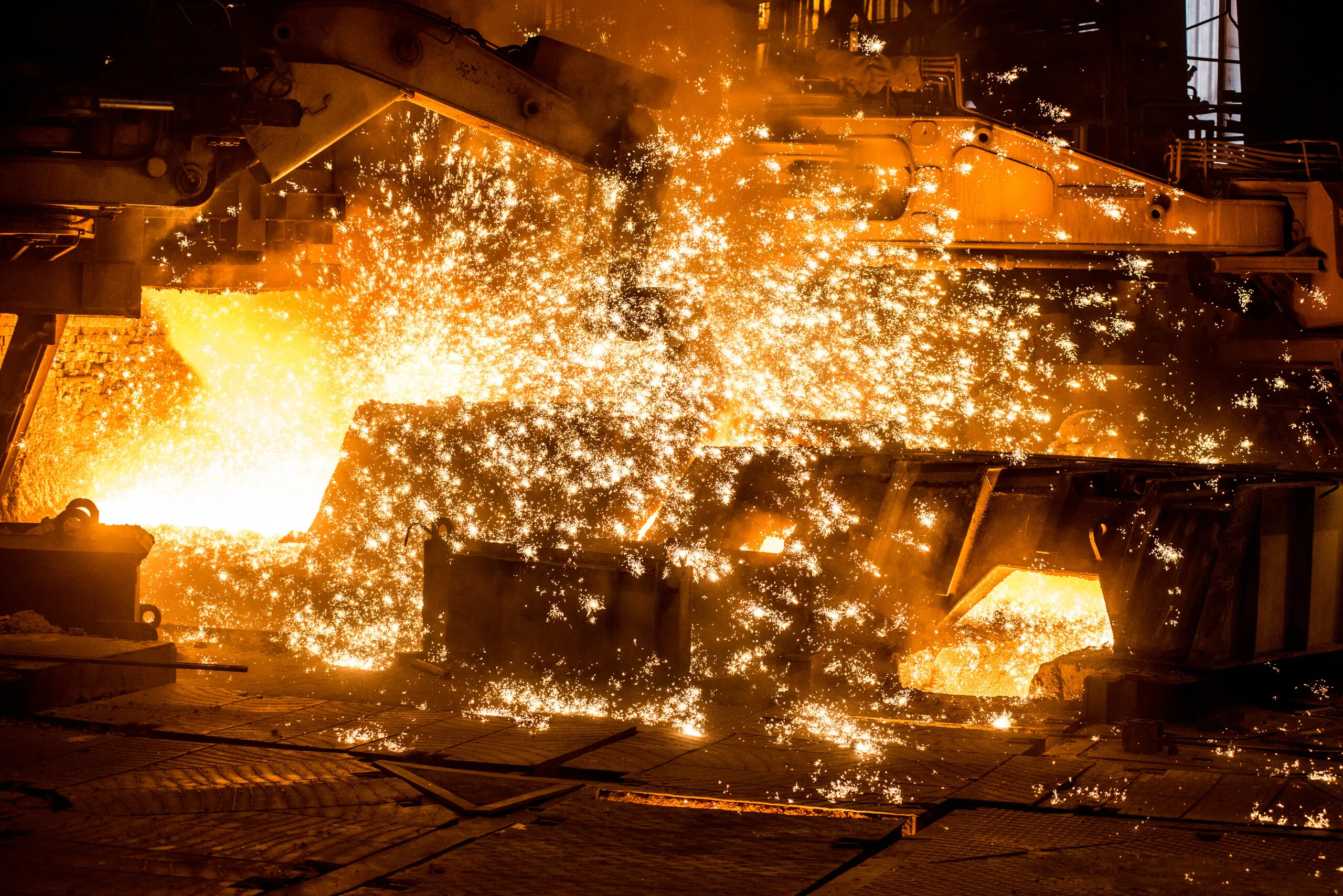 Molten steel being tapped in a shower of sparks